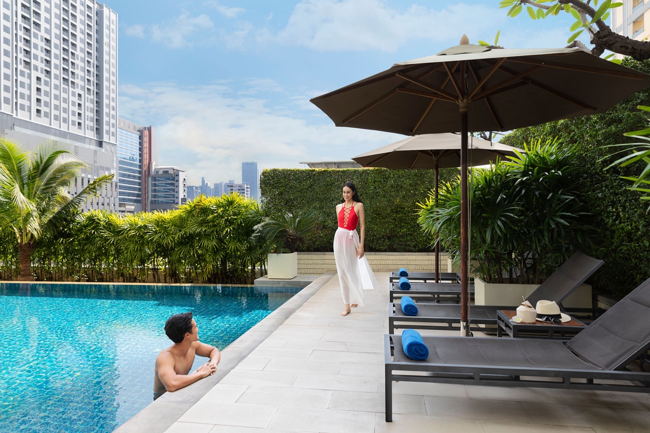 Couple relax at our outdoor saltwater pool