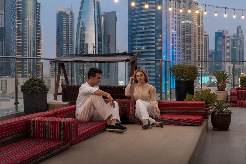 Rooftop seating area with city buildings behind
