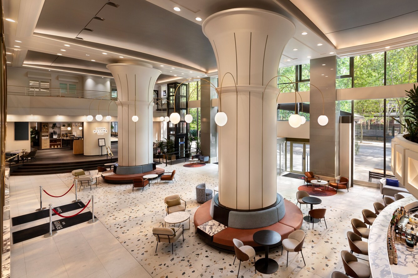 Hotel lobby with seating bar and tall columns