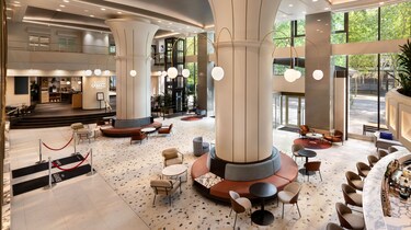 Hotel lobby with seating bar and tall columns
