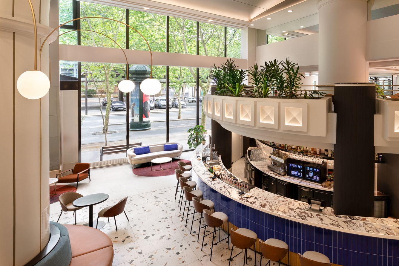 Curved lobby bar with seating and windows