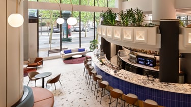 Curved lobby bar with seating and windows
