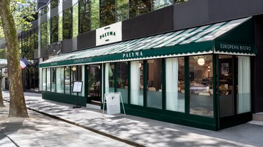 Palyma Bistro exterior with green striped awning