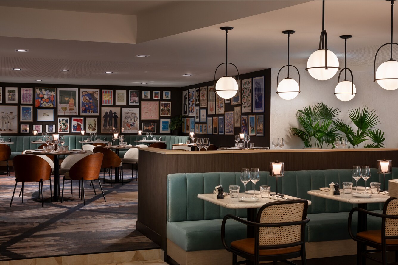 Palyma Bistro seating beside framed gallery wall