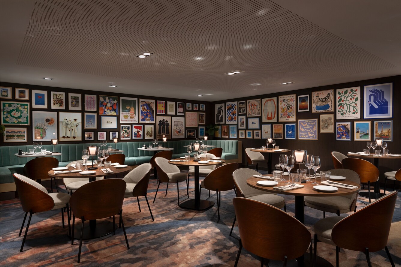Palyma Bistro dining area with framed artworks