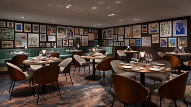 Palyma Bistro dining area with framed artworks