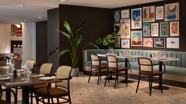 Palyma Bistro dining room with artwork and seating