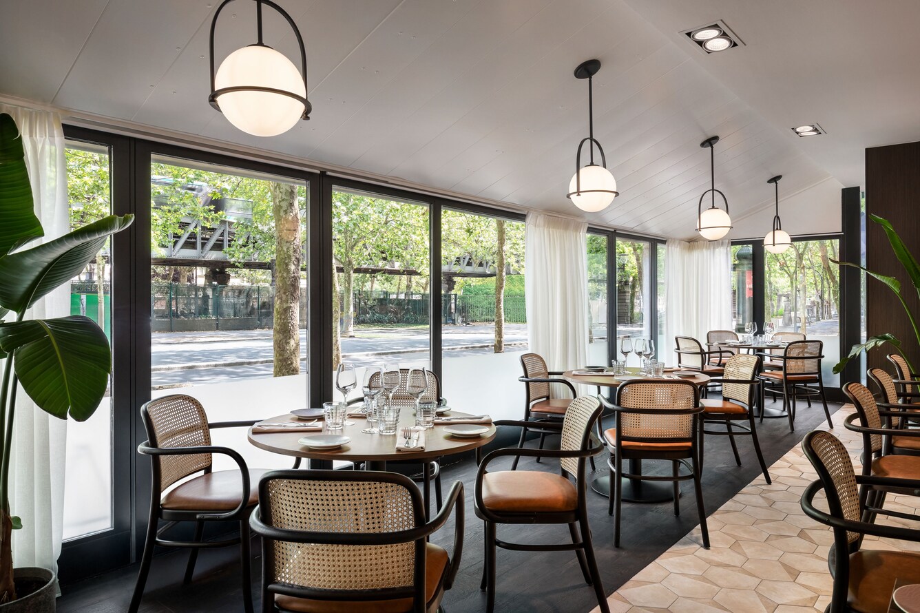 Palyma Bistro tables and floor to ceiling windows