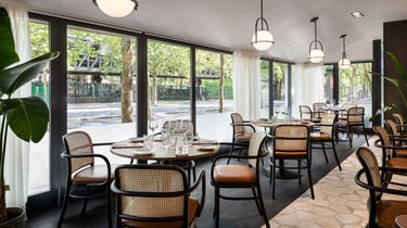 Palyma Bistro tables and floor to ceiling windows