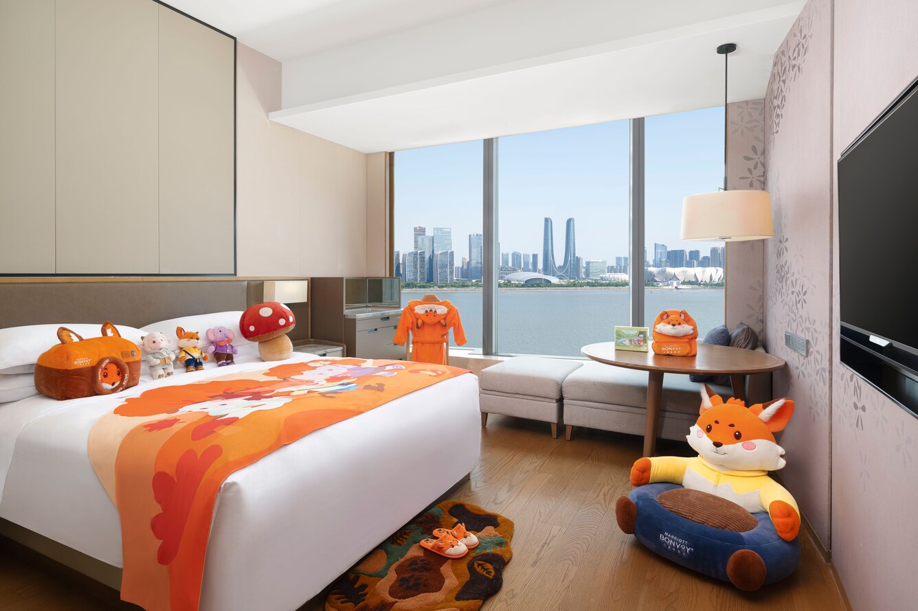 King guest room with city and water view