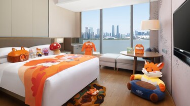 King guest room with city and water view