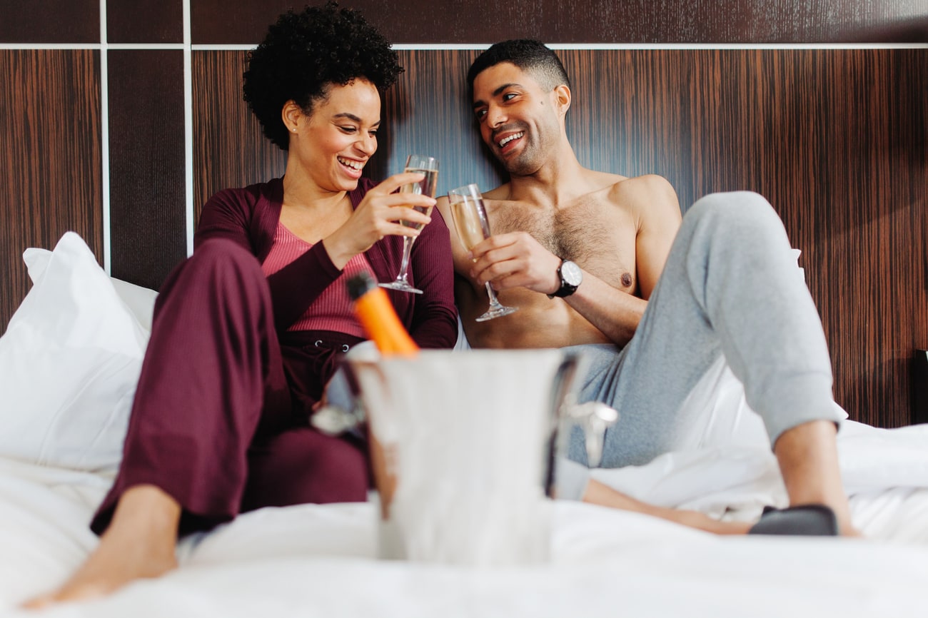 couple, toast, champagne, bed