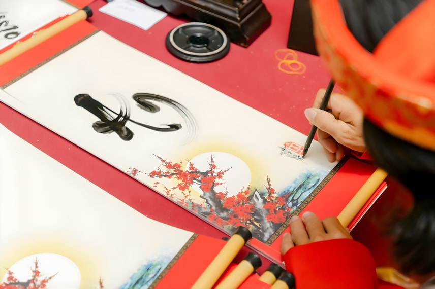 Traditional Tết calligraphy with festive red paper