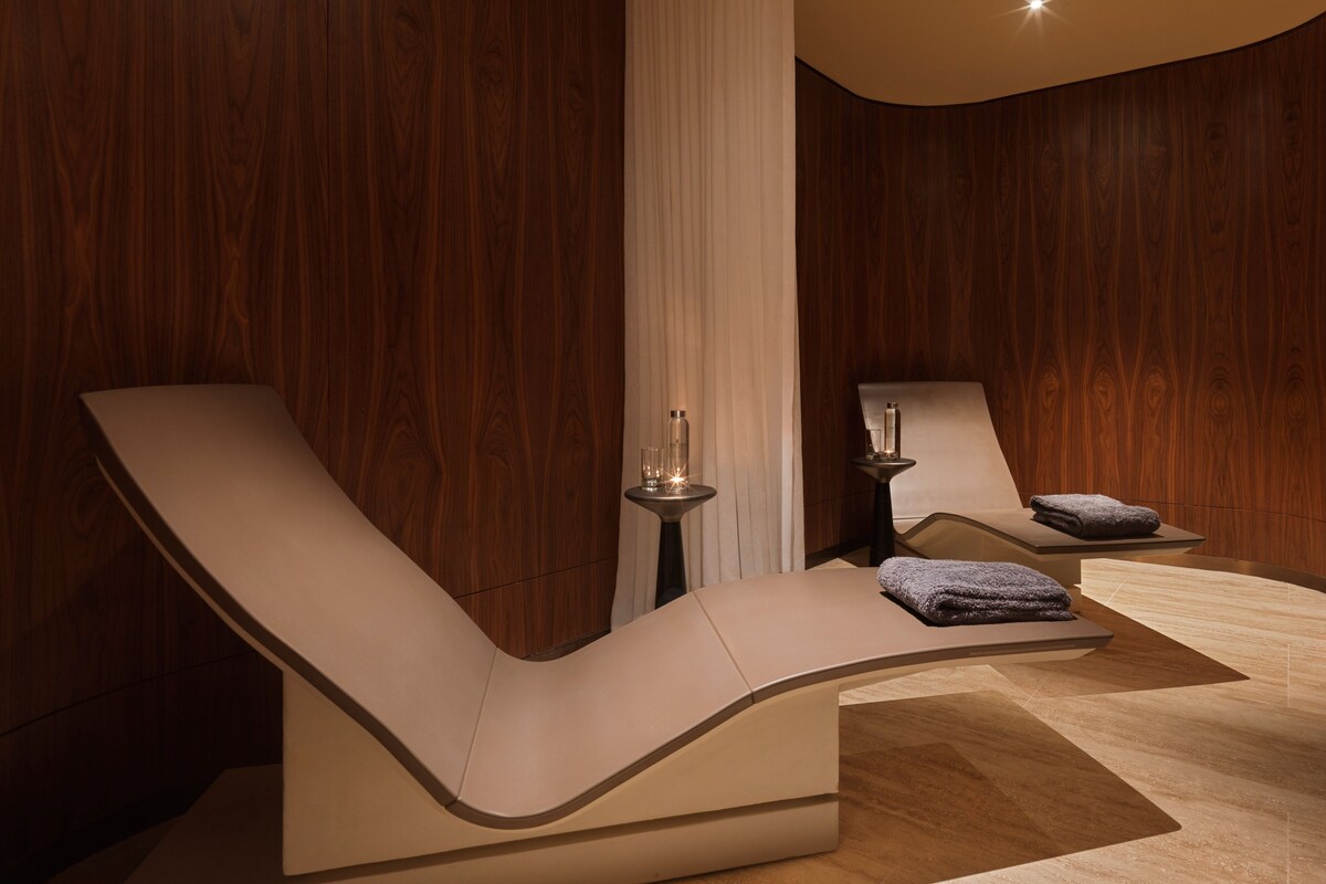 Curved spa loungers in tranquil relaxation room