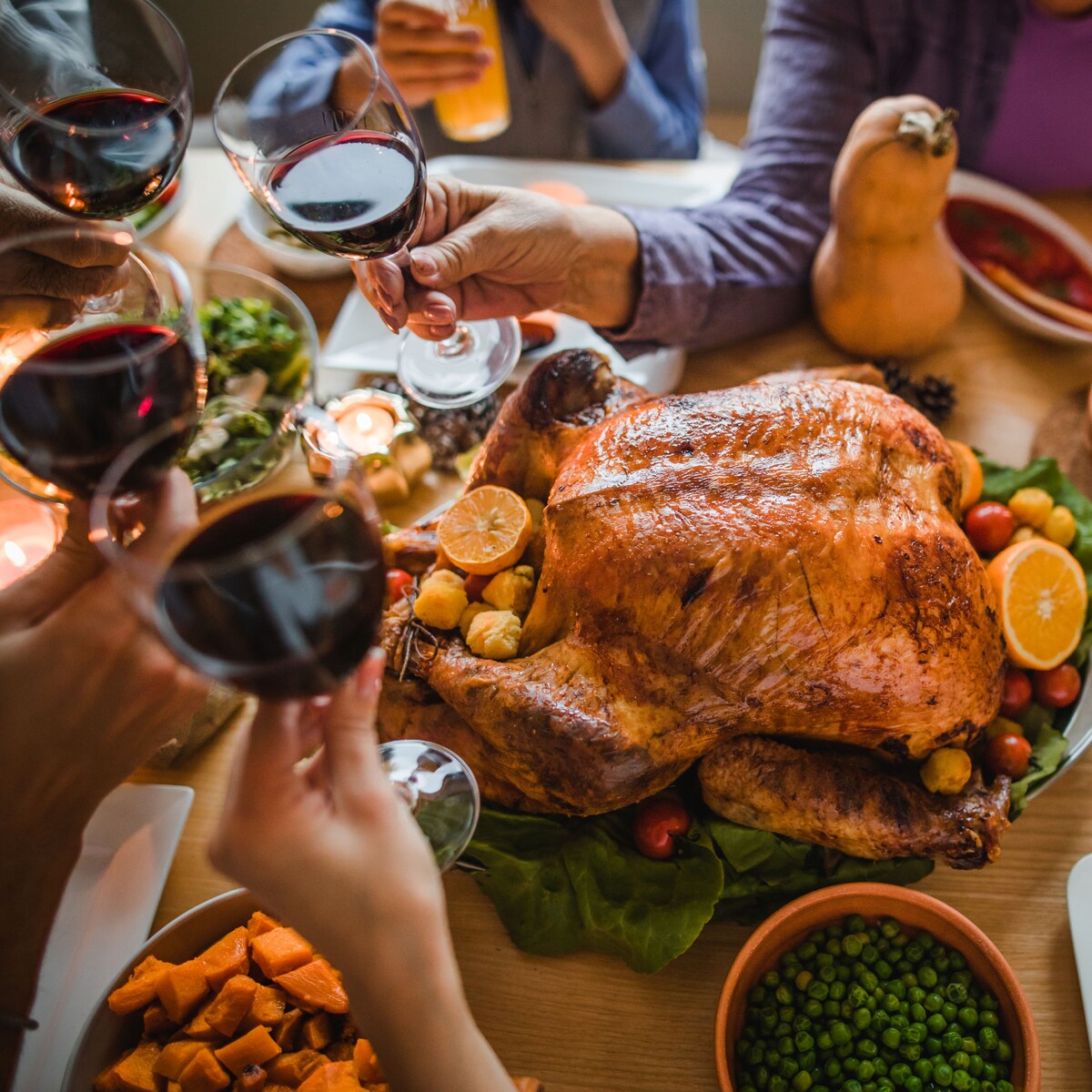 Family dinner with roasted turkey and shared sides