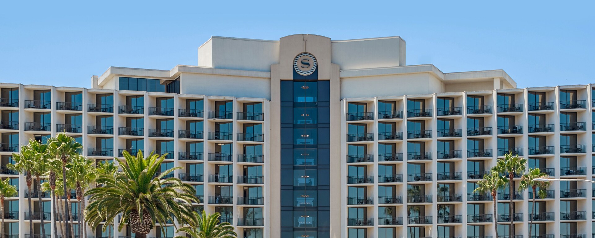 exterior of hotel with marina views