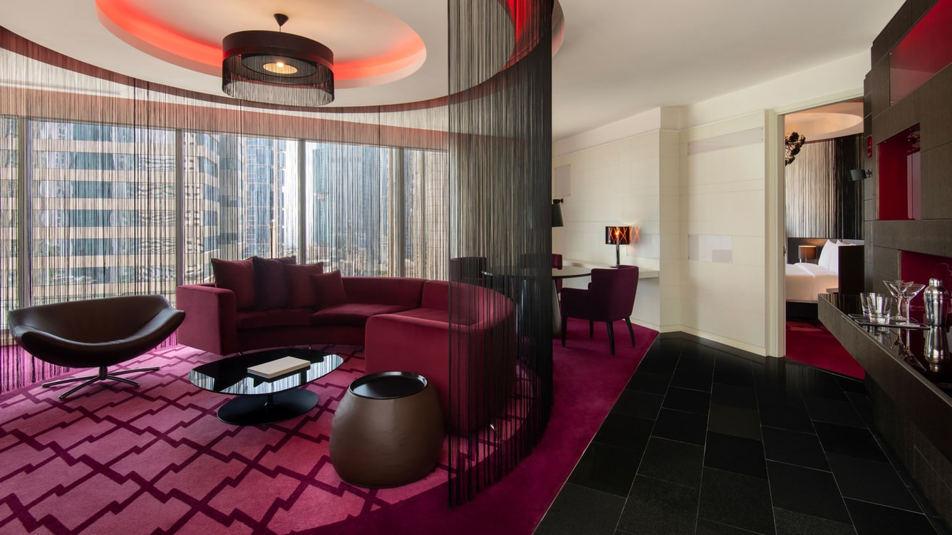 Suite living area with sofa and dining space