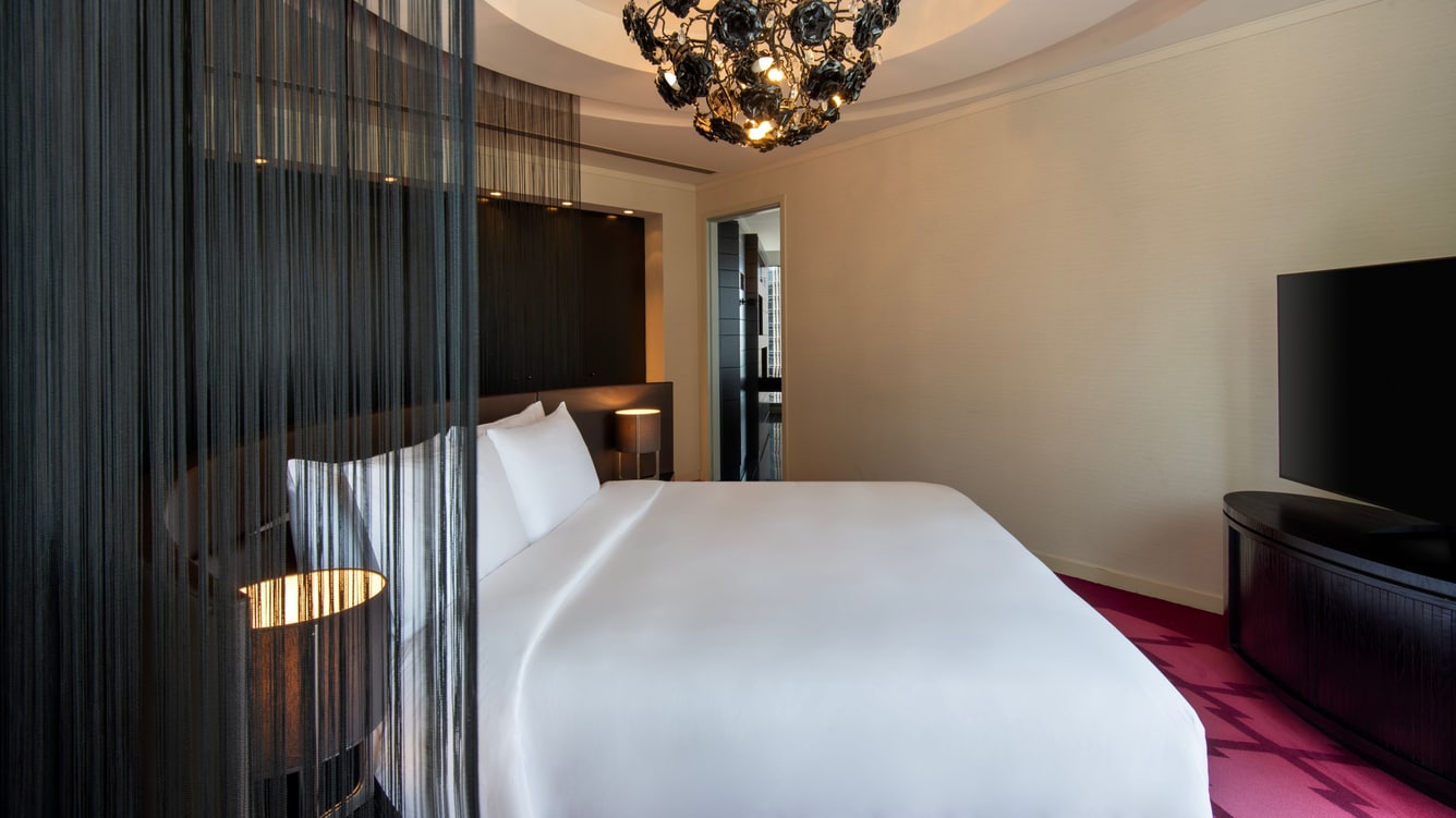 Bedroom with king bed and modern lighting