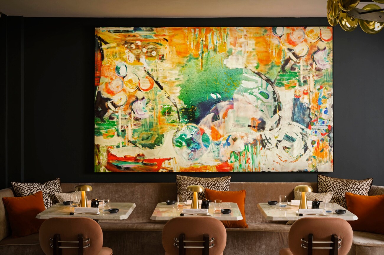 Dining area with colorful art Akira Back Florence