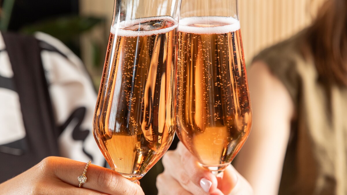 Two people toasting with champagne glasses