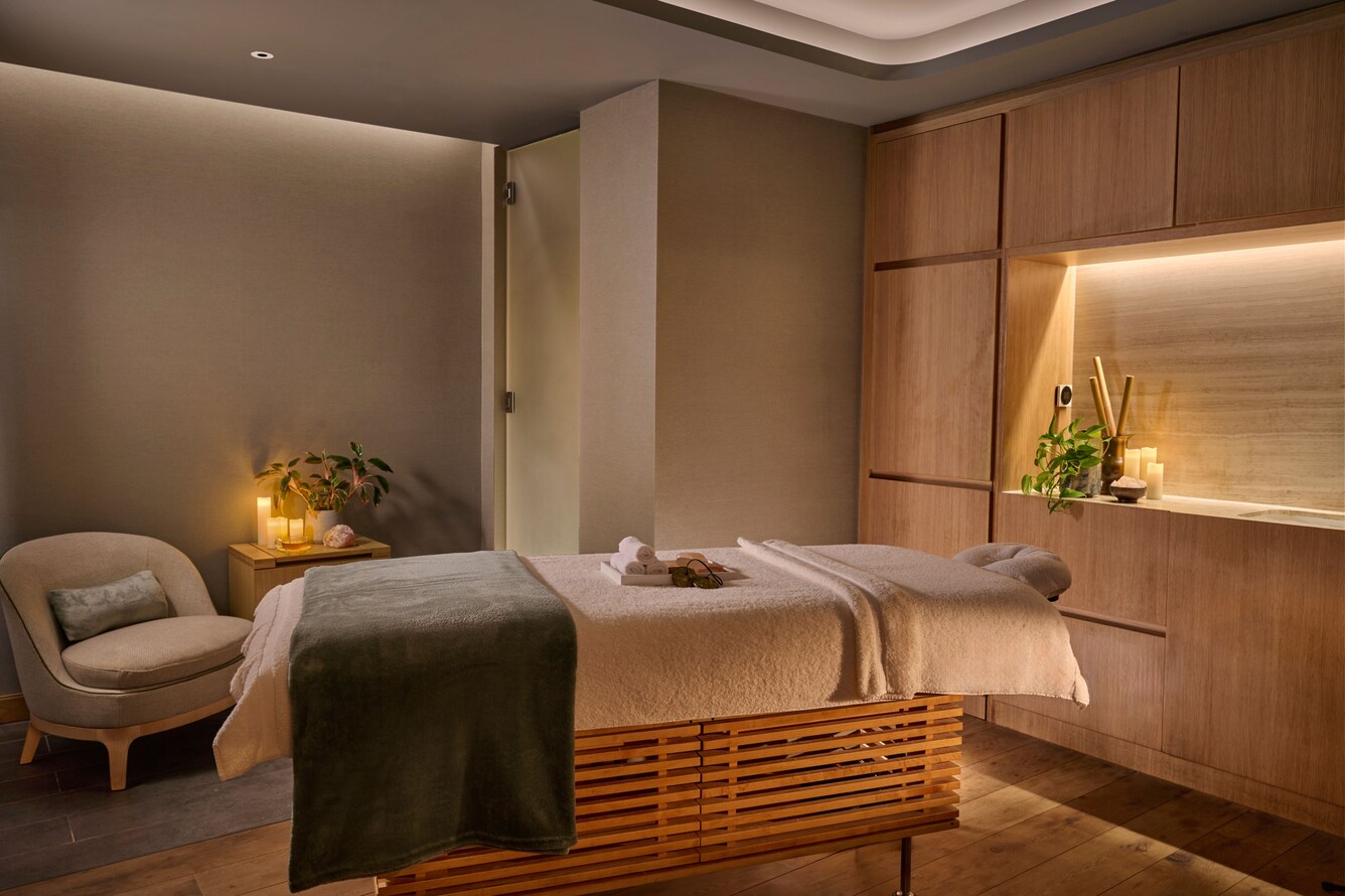 Spa treatment room with a massage bed
