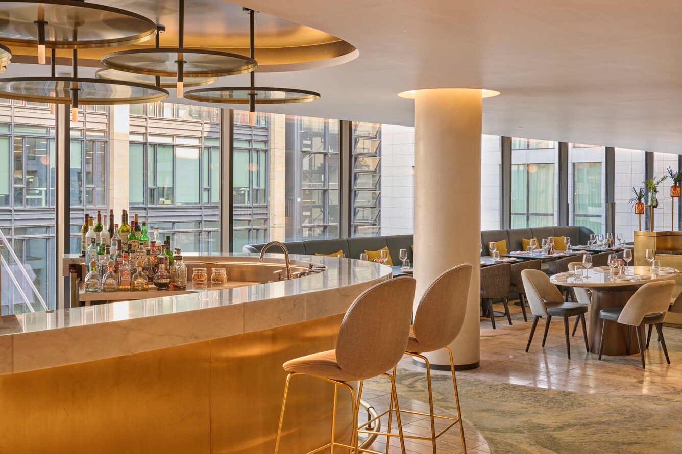 Bar area, tables, chairs, city view